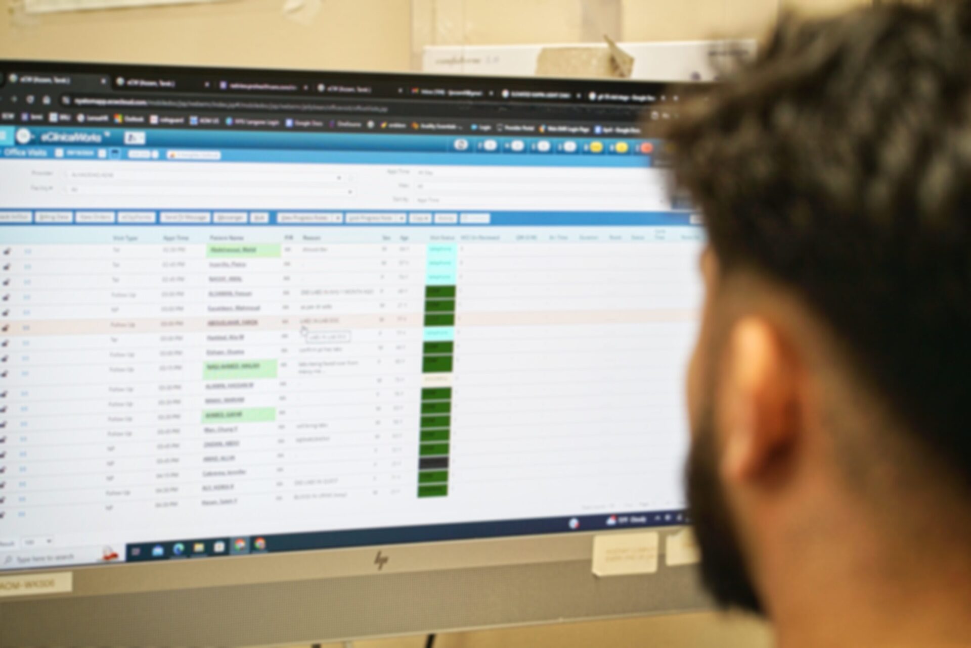 Happy female doctor at office with patient